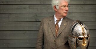 SEAMUS HEANEY AUTHOR OF THE ACCLAIMED TRANSLATION OF BEOWULF HOLDS A REPLICA OF THE SUTTON HOO HELMET AT THE OPENING OF A NEW EXHIBITION CENTRE AT THE SUTTON HOO SITE WHICH INCLUDES TREASURES LENT BY THE BRITISH MUSEUM.  13/3/02